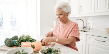 older-woman-preparing-a-salad